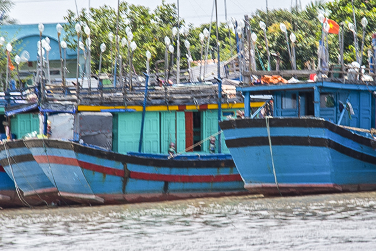 Fishing Boats on the Tien Giang River in the Mekong Delta in Vietnam