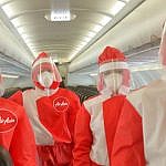 Air Asia crew wearing face masks