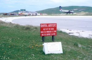A plane landing at Barra International Airport in Scotland.