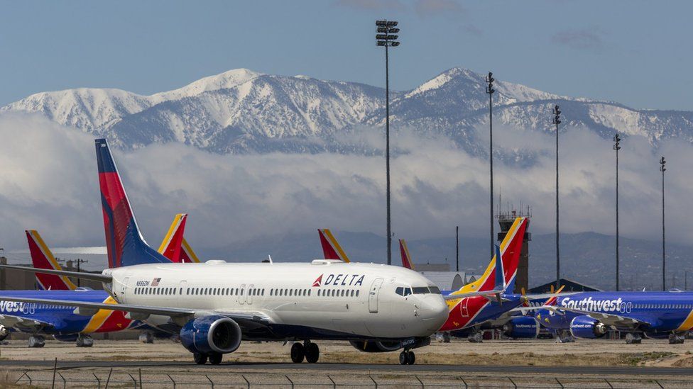 Delta airplane with mountain background