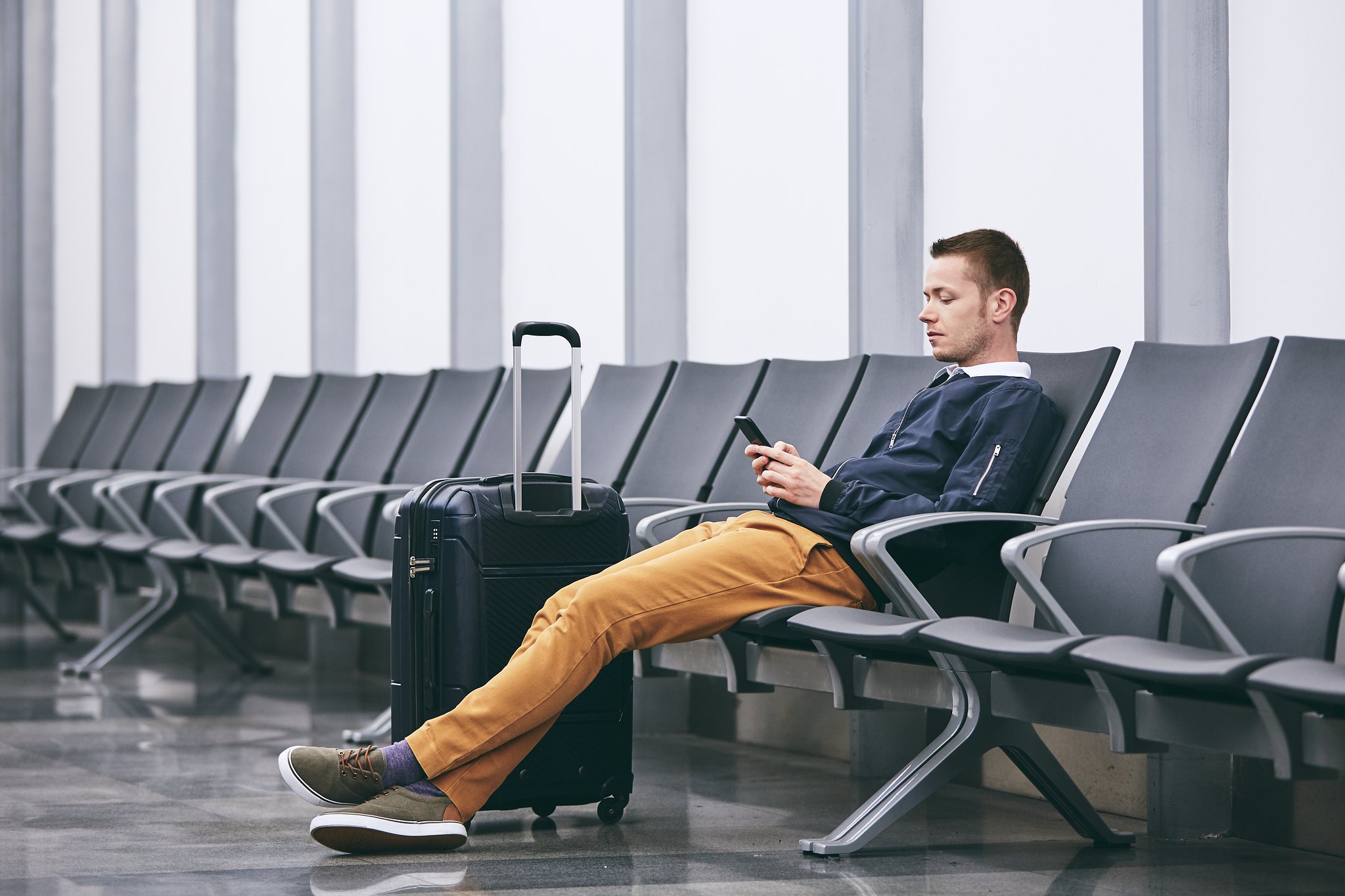Passenger waiting to fly inside airport terminal
