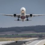 An Emirates B777-300ER taking off