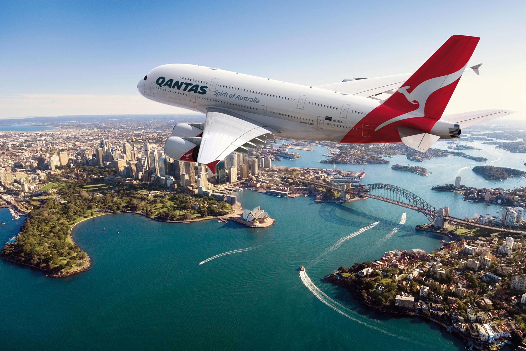 Qantas jet flying over iconic Sydney harbour bridge