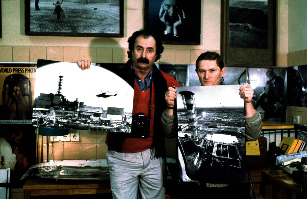 Two brave photographers posing iwth their famous photographs taken from a helicopter over Chernobyl Nuclear Power plant