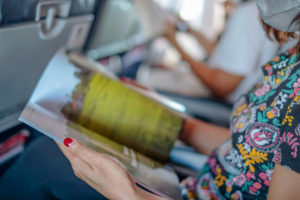 Woman reading inflight magazine