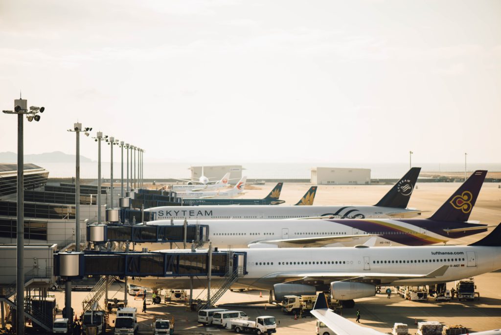 View of planes at their gates. Photo by Chuttersnap