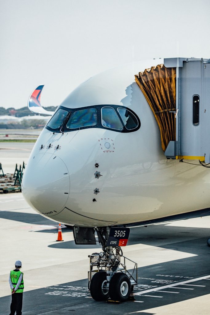 A Delta A350 ready for boarding. Photo by A plane ticket and passport. Photo by Fidel Fernando