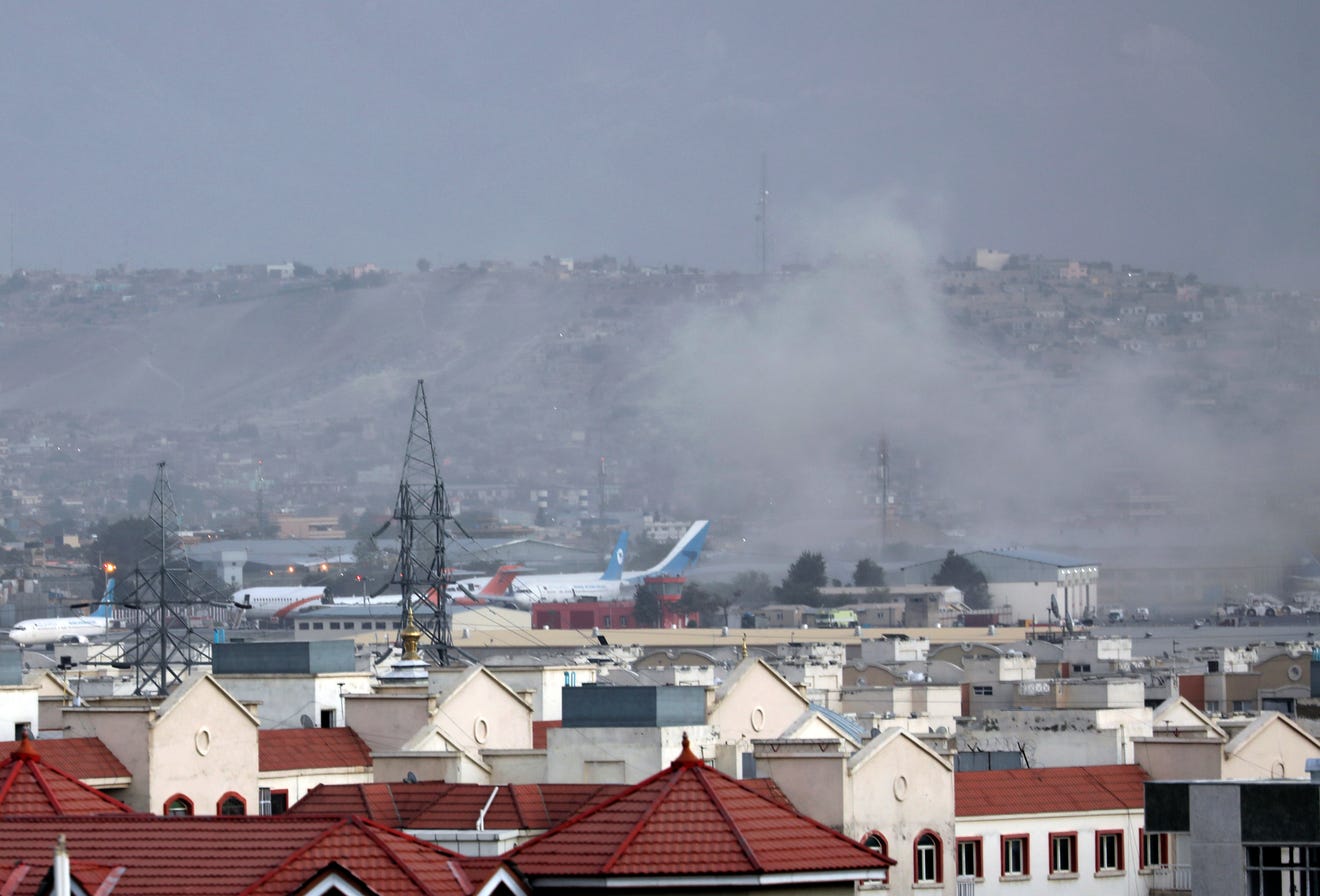 Smoke rises from Kabul Airport after a large explosion at the Abbey Gate following several western agencies reporting a terrorist threat just hours earlier