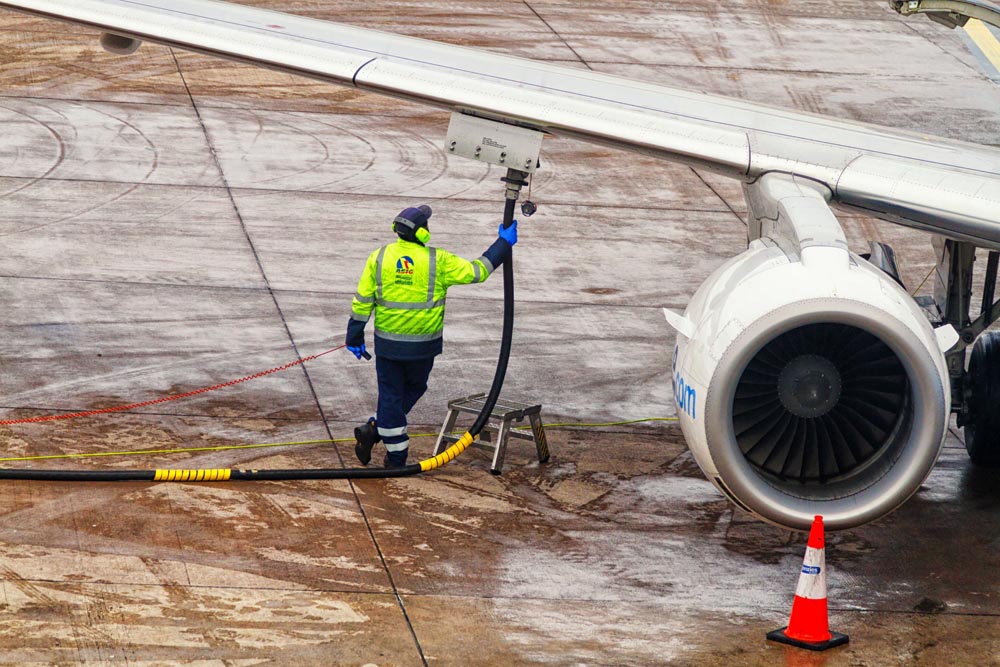 aviation fuel being pumped into wing refuelling