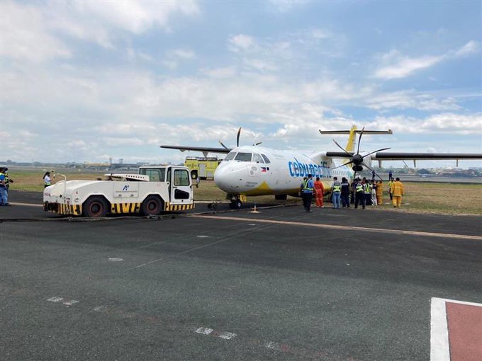 CebGo flight DG 6112 being towed back onto the tarmac at Manila