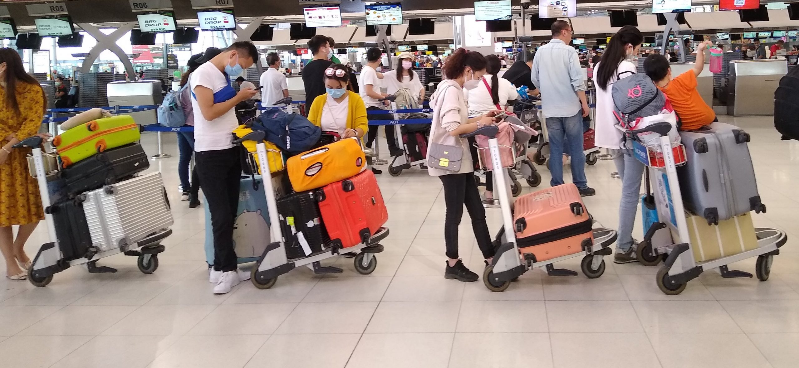 Passengers queue at Shanghai airport