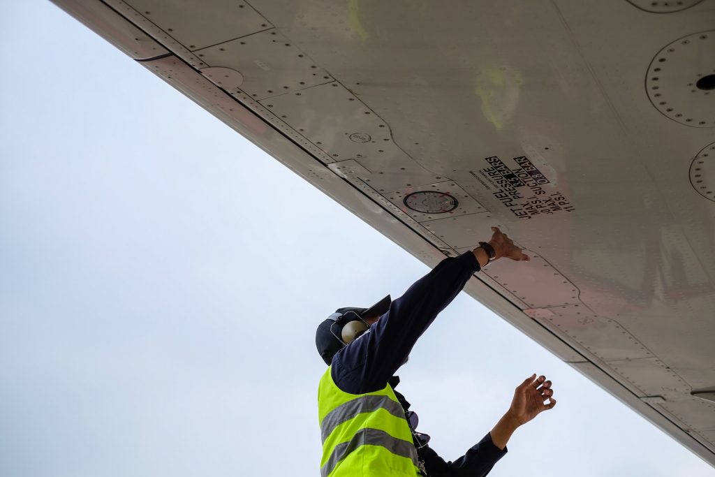 engineer works on aircraft