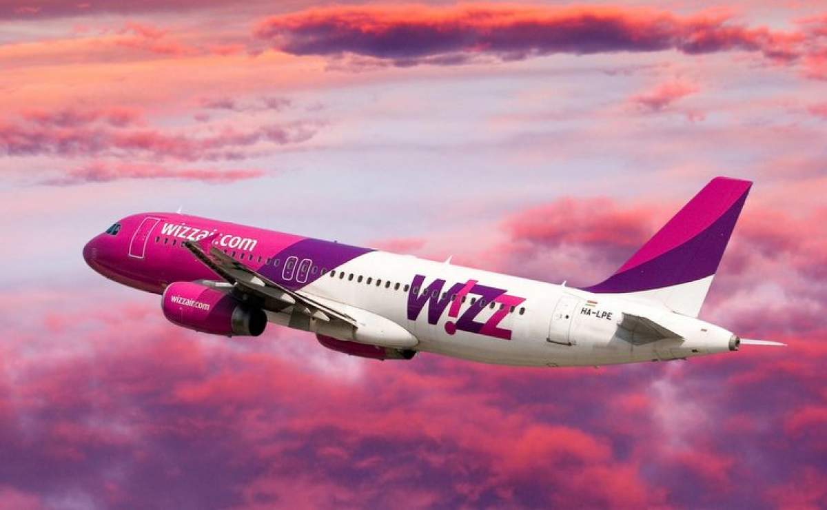 Wizz air plane in pink clouds