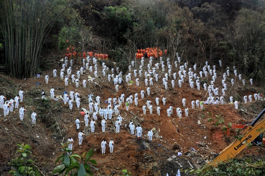 Investigators at the China Eastern crash site