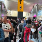Passengers in line at security - London Heathrow Airport