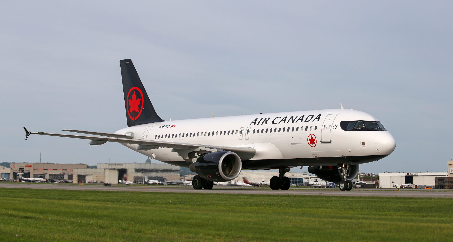 Air Canada aircraft sits on runway.