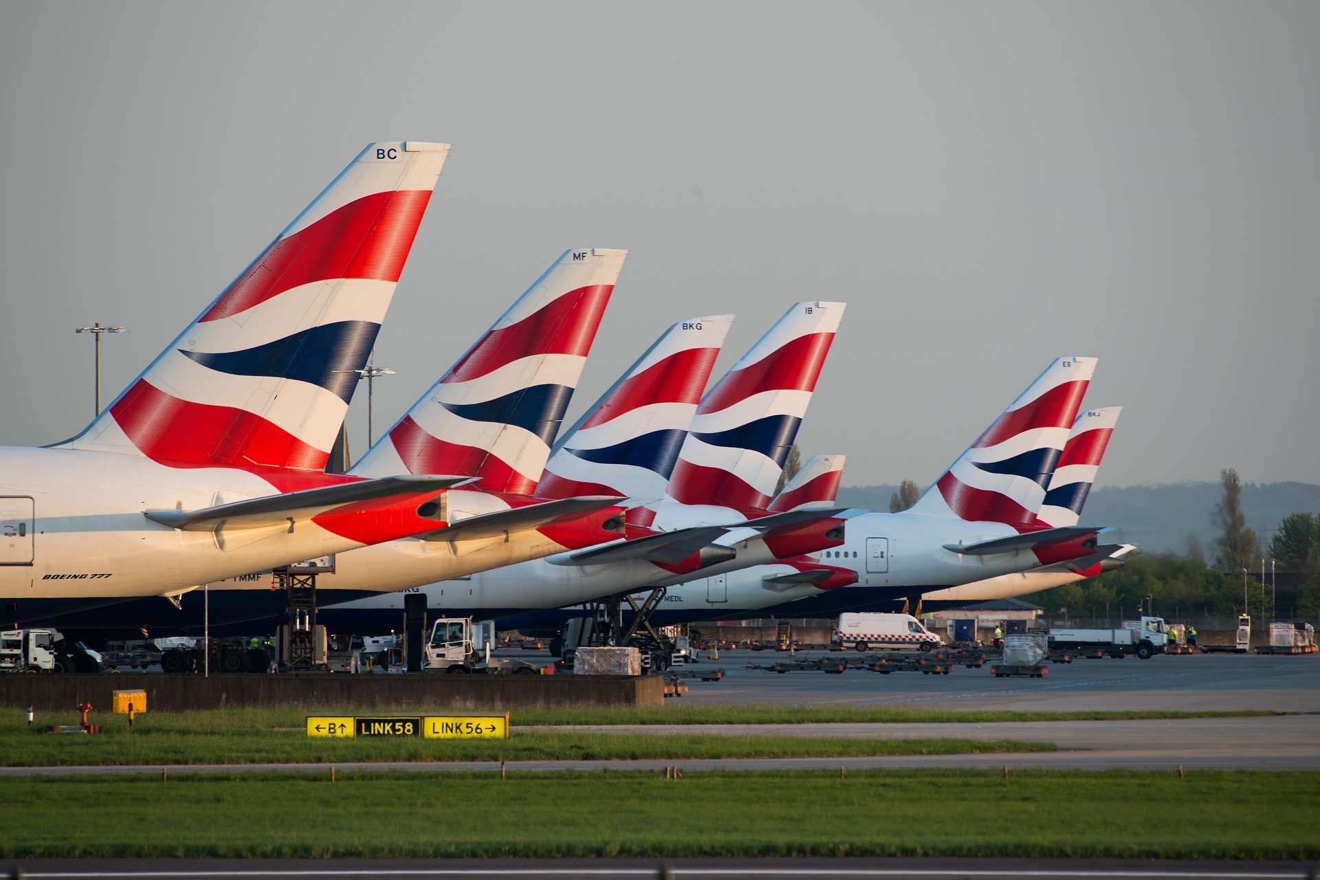 british airways g75a38830c 1920 Seven BA planes parked on airport tarmac.