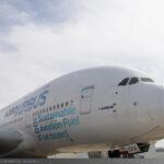 Airbus A380 close up showing 100% sustainable aviation fuel onboard logo