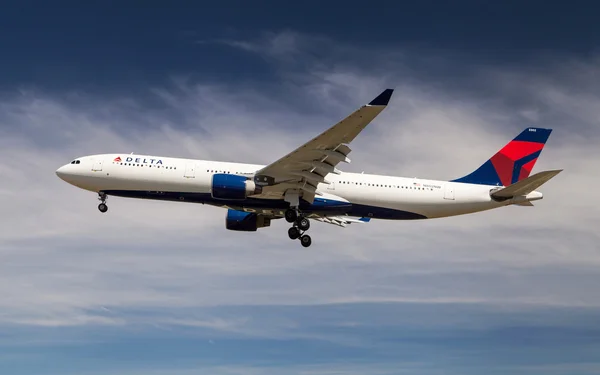 The image of a flying Delta Air Lines aircraft.