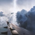 The image of a view from a flying plane during weather conditions.