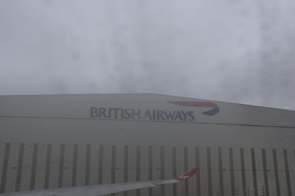View of Heathrow Airport (LHR) from the window of a stationary Virgin Atlantic Airbus on the tarmac.