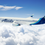 An aeroplane in the sky with clouds