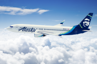 An aeroplane in the sky with clouds