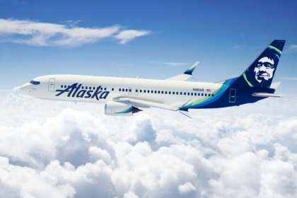 An aeroplane in the sky with clouds