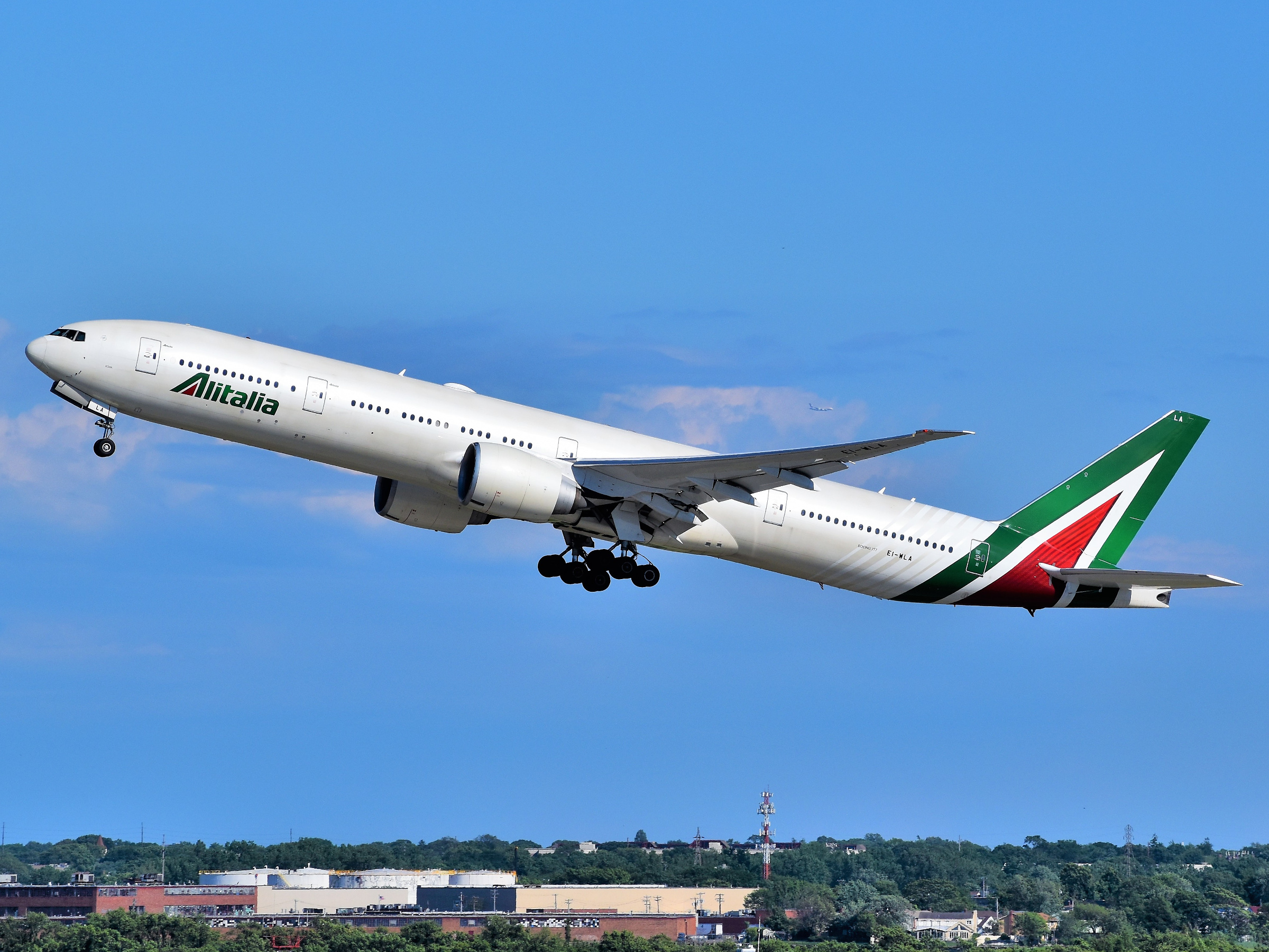 An Alitalia Boeing 777-300ER is taking off from Runway 4L at John F. Kennedy International Airport as Flight AZ609.