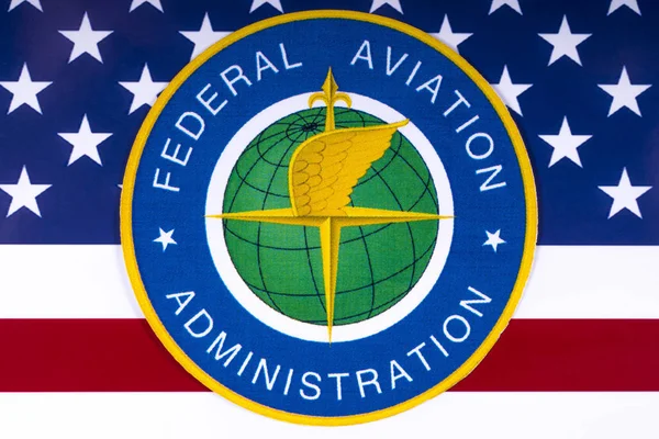 The image of the symbol of the Federal Aviation Administration portrayed with the US flag.