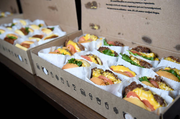 A box of multiple Shake Shacks cheeseburgers 