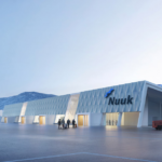 A concept design of Nuuk International that includes the terminal, a runway and an aircraft on the tarmac.