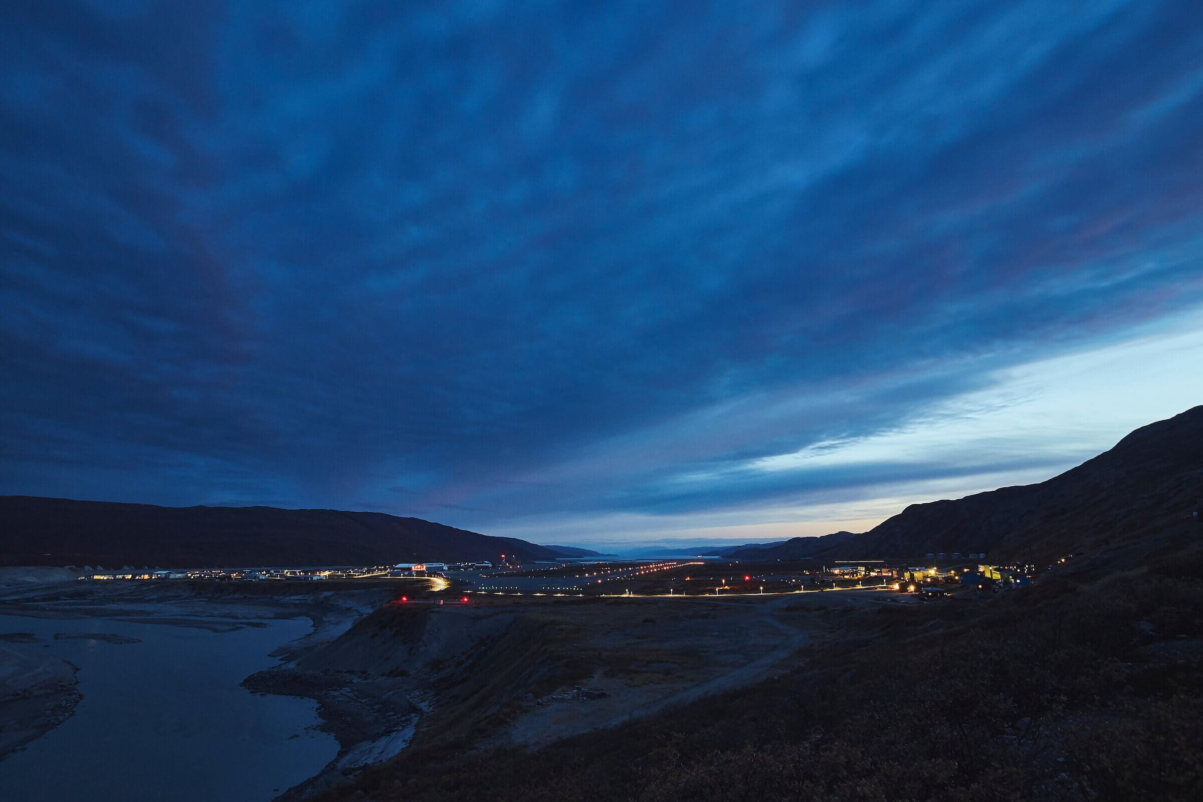 Kangerlussuaq tarmac lit up at night time.