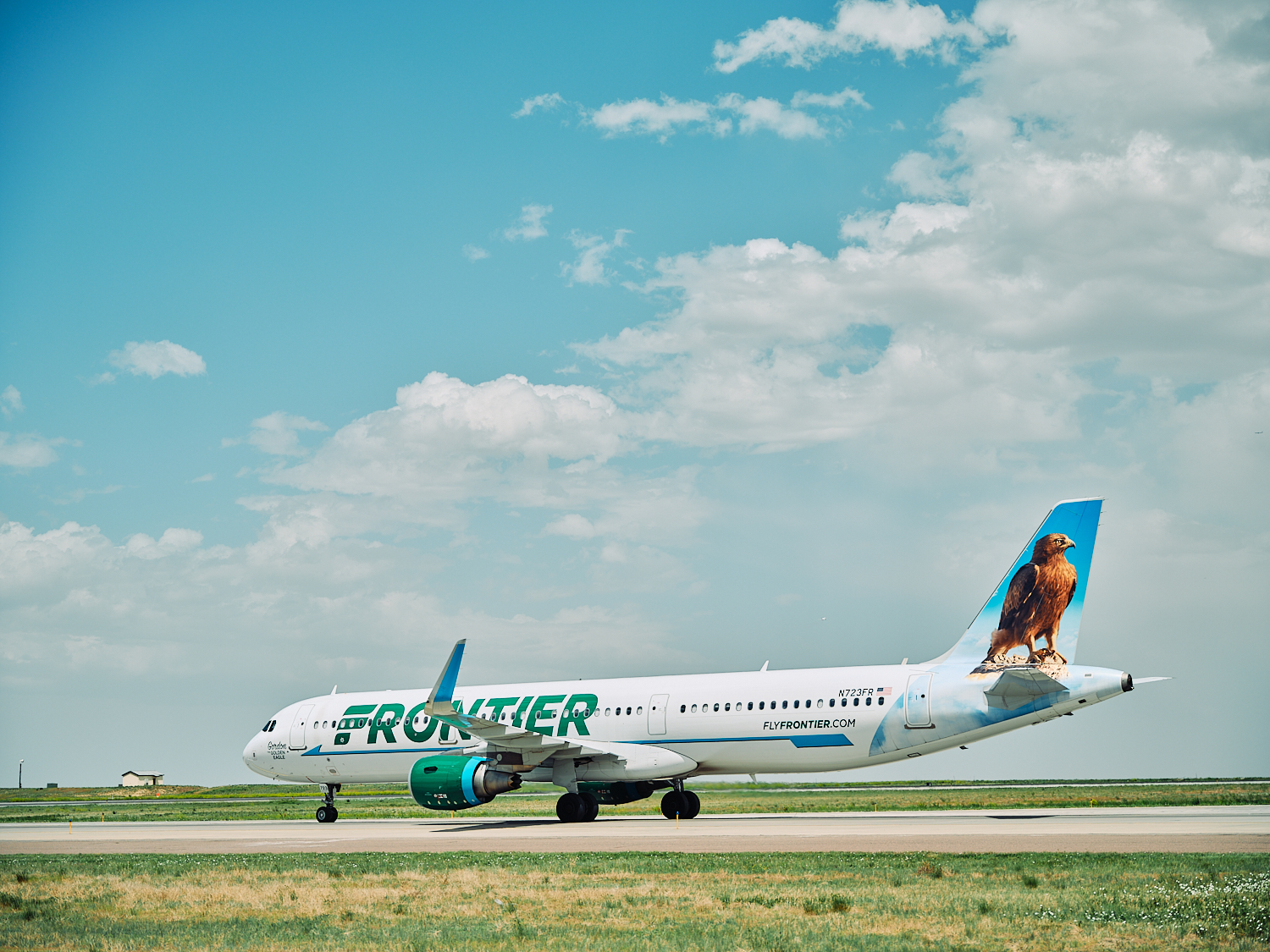 A Frontier Airlines plane on a runway