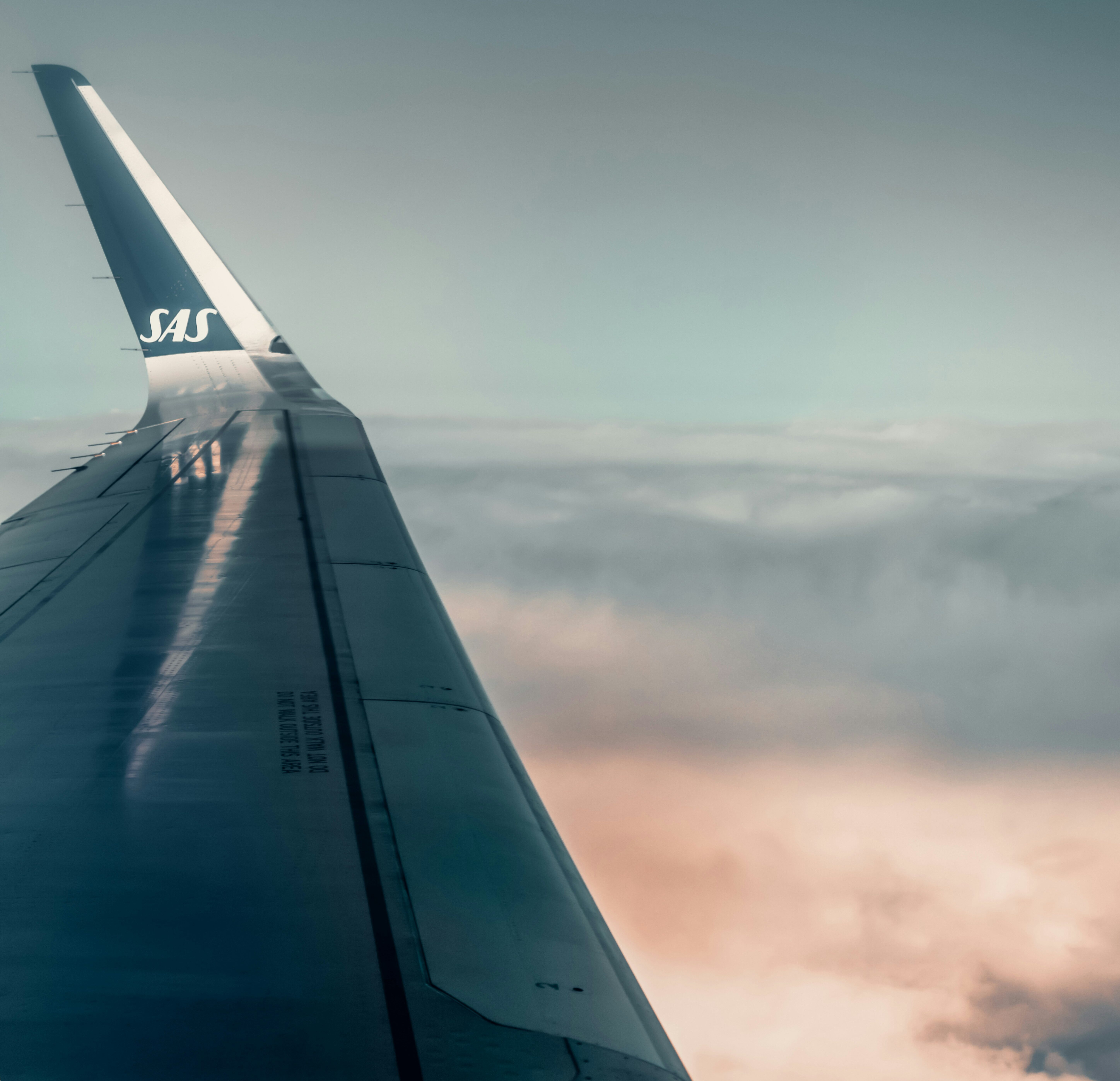 SAS airline flight flying over clouds 