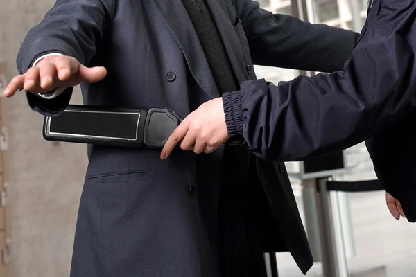 The image of security check at the airport.