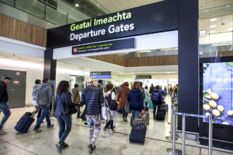 Passengers pass through airport departures