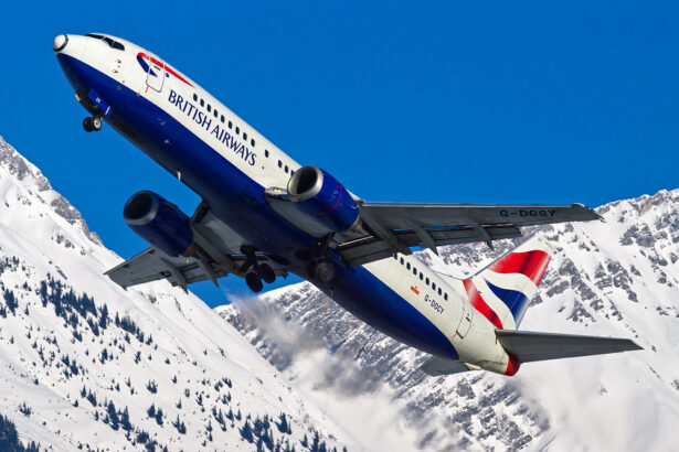 A British Airways 737 plane flying over snowy terrain. Direct flights from London Heathrow to Tromsø are now available.