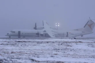 Air Canada Flight 2259 stationary on the runway after an emergency landing.