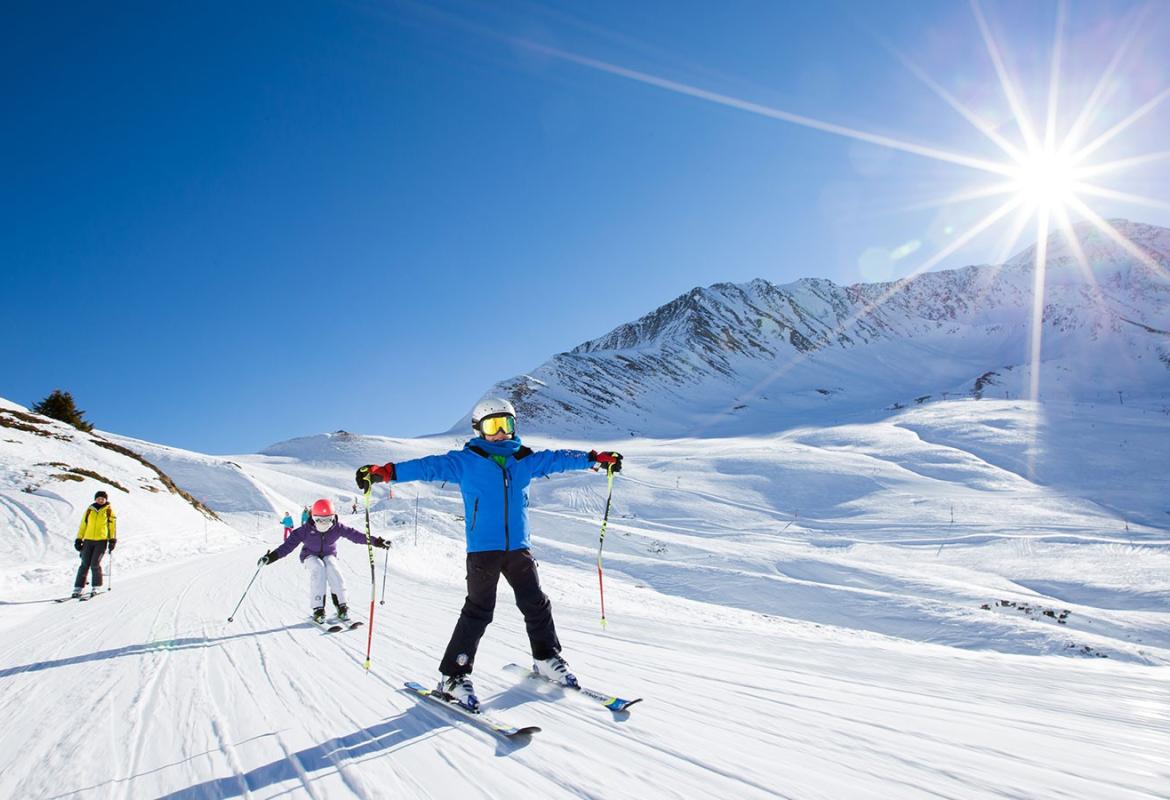 A person skiing and having fun in the snow.