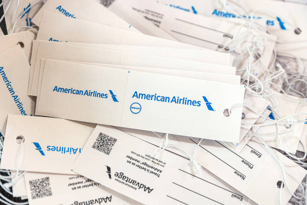 A bunch of American Arline baggage tags stacked on top of one another.