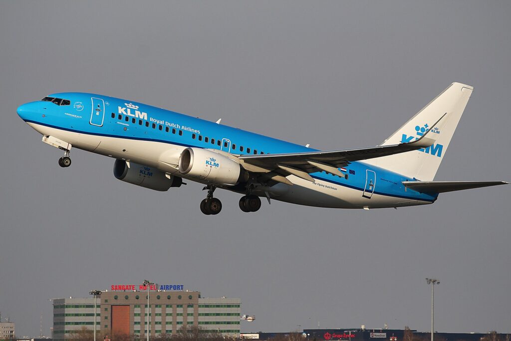 KLM airplane in flight, representing the airline's flight suspensions to the Middle East due to security concerns.