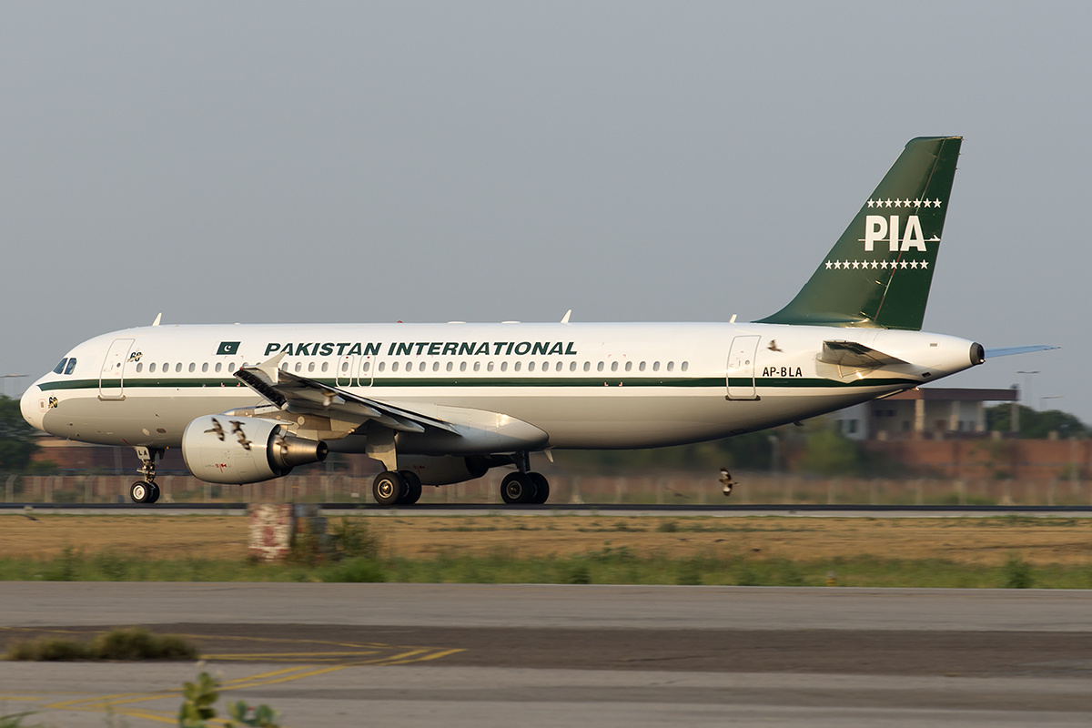 A Pakistan International Airlines Airbus A320 on a runway. 