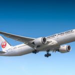 A Japan Airlines plane in flight, captured by Fariz Priandana.