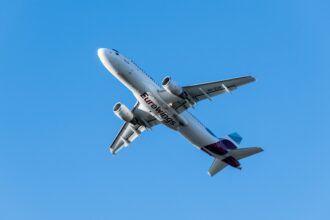 Eurowings flight overhead in blue sky- 2024 Summer Schedule expanded