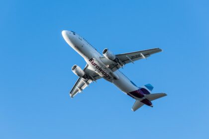 Eurowings flight overhead in blue sky- 2024 Summer Schedule expanded