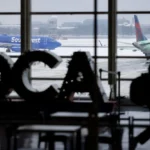Airplanes on the tarmac during a snowstorm at Ronald Reagan Washington National Airport in Arlington, Virginia, US, on Monday