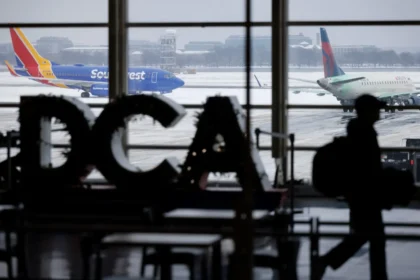 Airplanes on the tarmac during a snowstorm at Ronald Reagan Washington National Airport in Arlington, Virginia, US, on Monday