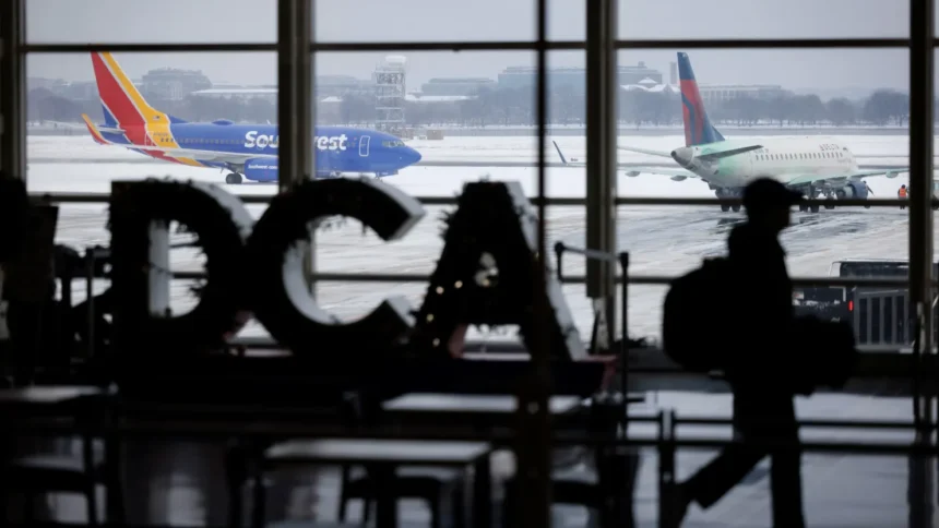 Airplanes on the tarmac during a snowstorm at Ronald Reagan Washington National Airport in Arlington, Virginia, US, on Monday