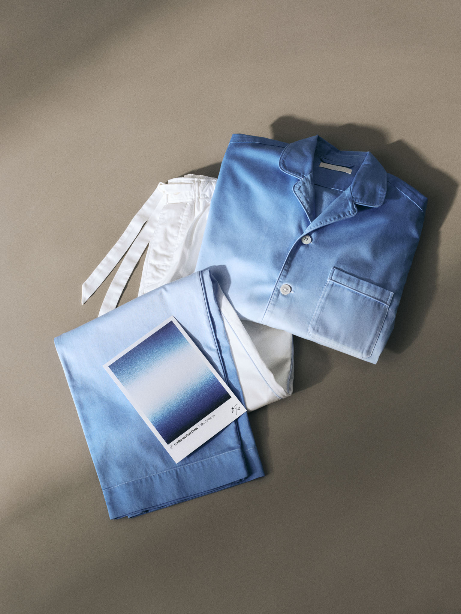 The azure, white, and dark blue gradient